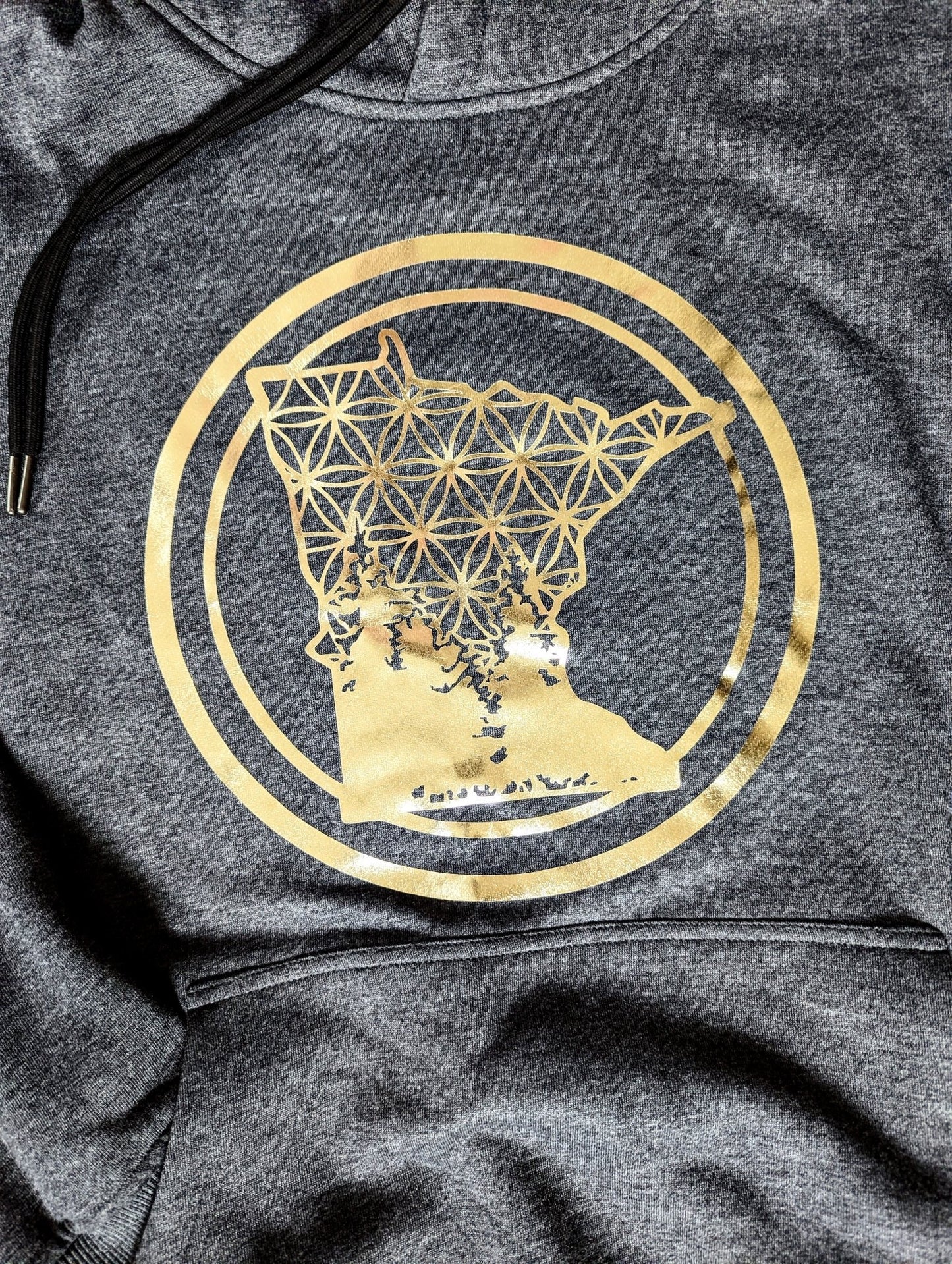 Our signature hand applied gold foil design on our hooded sweatshirt. Pressed to stay on for the lifetime of the hoodie.