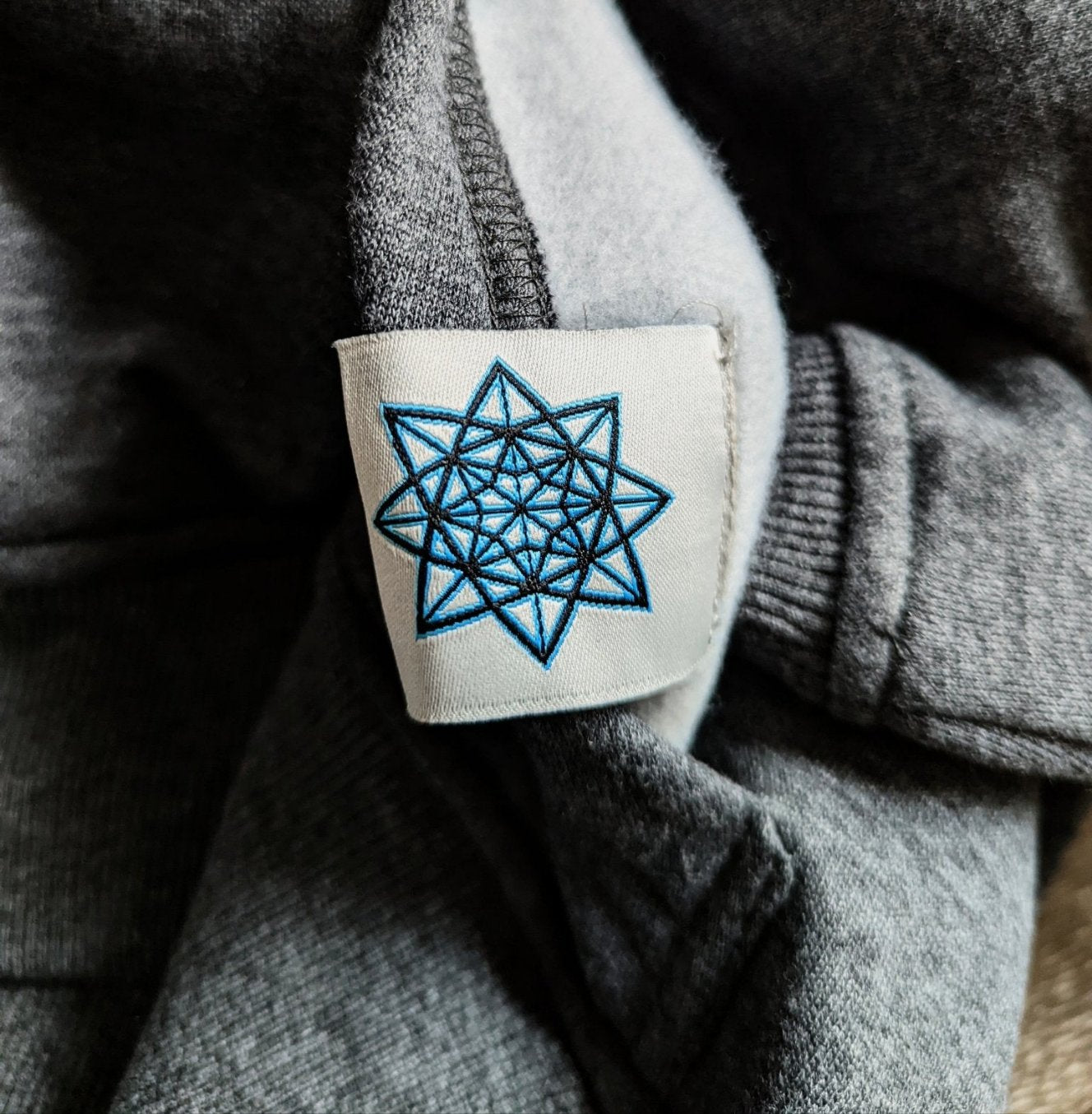 A little surprise on the inside of the hoodie tag. Our hand drawn emblem adds to the total customization of our garment